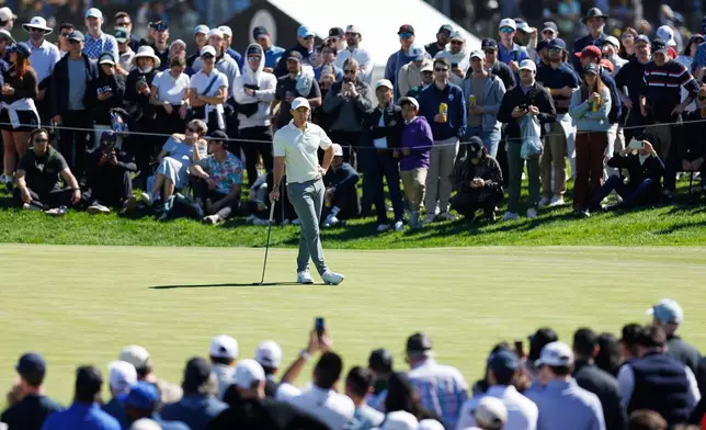 Rory McIlroy, from Northern Ireland, waits to putt on the third green during the third round of the Genesis Invitational golf tournament at Riviera Country Club, Saturday, Feb. 21, 2026, in the Pacific Palisades area of Los Angeles. (AP Photo/Caroline Brehman )