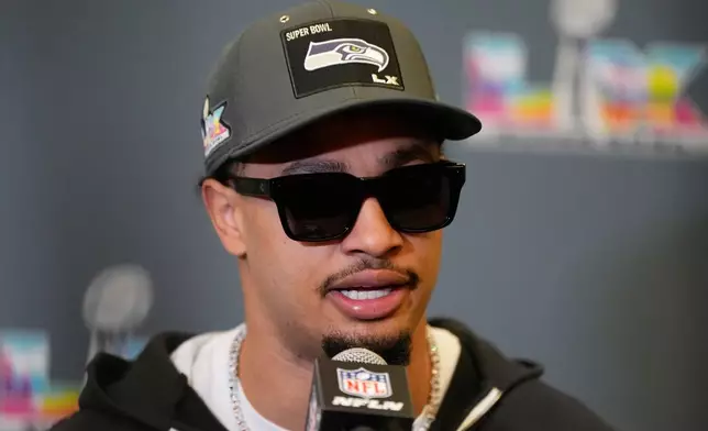 Seattle Seahawks wide receiver Jaxon Smith-Njigba speaks during a NFL Super Bowl news conference on Tuesday, Feb. 3, 2026, in San Jose, Calif., ahead of Super Bowl 60 between the New England Patriots and the Seattle Seahawks. (AP Photo/Brynn Anderson)