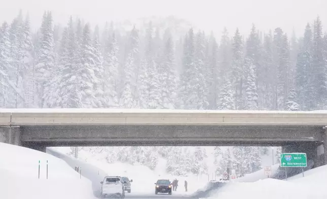 Snow covers a road on an underpass along interstate 80 on Wednesday, Feb. 18, 2026 near Soda Springs, Calif. (AP Photo/Brooke Hess-Homeier)