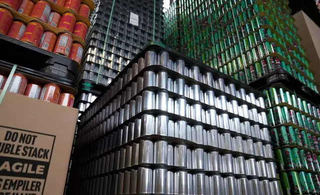 Empty aluminum cans are stacked at Revolution Brewing, Friday, Feb. 20, 2026, in Chicago. (AP Photo/Erin Hooley)