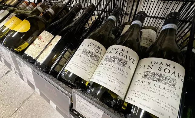 FILE - Italian bottles of white wines are dispalyed at a liquor store in Niles, Ill., Thursday, March 13, 2025. (AP Photo/Nam Y. Huh, File)