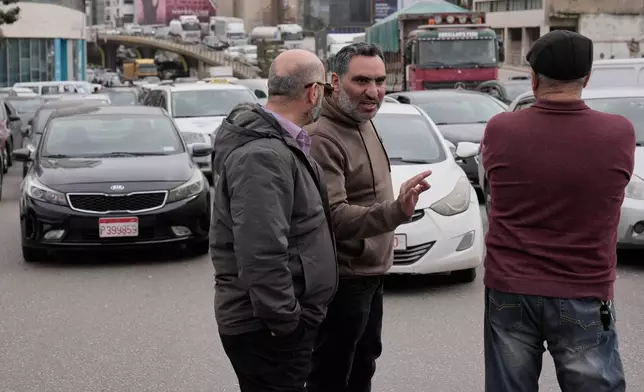 Taxi drivers block a main highway with their cars during a protest against the increased taxes and gasoline prices issued by the Lebanese Cabinet on Monday, in Beirut, Lebanon, Tuesday, Feb. 17, 2026. (AP Photo/Hussein Malla)