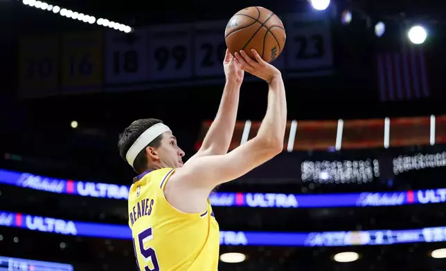 Los Angeles Lakers guard Austin Reaves looks to shoot during the first half of an NBA basketball game against the Los Angeles Clippers, Friday, Feb. 20, 2026, in Los Angeles. (AP Photo/Jessie Alcheh)