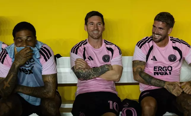Lionel Messi, center, Micael Dos Santos Silva, left, and Rodrigo de Paul of Inter Miami are seen during warmups before their international friendly soccer match against Ecuador's Independiente del Valle in Bayamon, Puerto Rico, Thursday, Feb. 26, 2026. (AP Photo/Alejandro Granadillo)