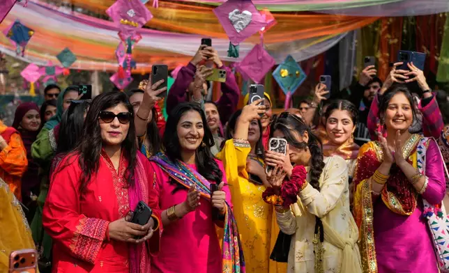 Students take part in a gathering to celebrate three-day kite flying festival 'Basant' at their university campus, in Lahore, Pakistan, Friday, Feb. 6, 2026. (AP Photo/K.M. Chaudary)