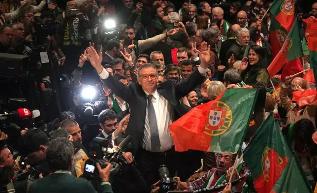 Center-left Socialist candidate António José Seguro celebrates after defeating far-right populist André Ventura in the second round of Portugal's presidential election in Lisbon, Sunday, Feb. 8, 2026. (AP Photo/Ana Brigida)