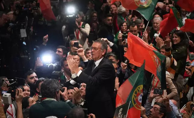Center-left Socialist candidate António José Seguro celebrates after defeating far-right populist André Ventura in the second round of Portugal's presidential election in Lisbon, Sunday, Feb. 8, 2026. (AP Photo/Ana Brigida)