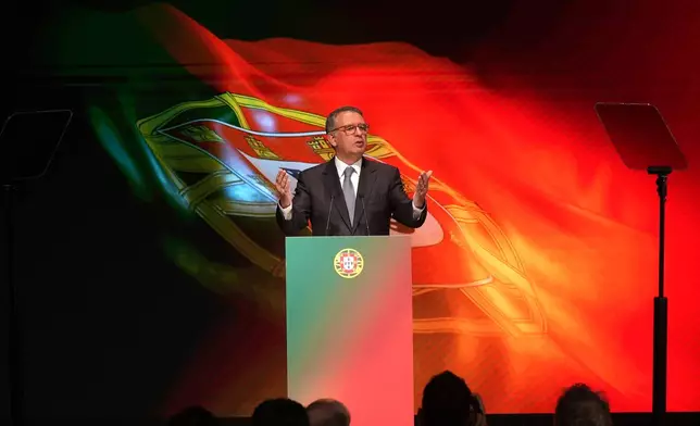 Center-left Socialist candidate António José Seguro talks after defeating far-right populist André Ventura in the second round of Portugal's presidential election in Lisbon, Sunday, Feb. 8, 2026. (AP Photo/Ana Brigida)