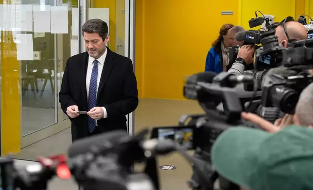 Presidential candidate Andre Ventura, of the populist Chega party, arrives at a polling station before voting in Portugal's presidential election in Lisbon, Sunday, Feb. 8, 2026. (AP Photo/Ana Brigida)