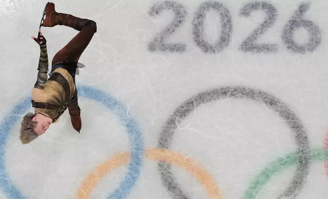 Ilia Malinin of the United States competes during the men's figure skating short program at the 2026 Winter Olympics, in Milan, Italy, Tuesday, Feb. 10, 2026. (AP Photo/Christophe Ena)