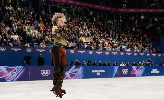 Ilia Malinin of the United States competes during the men's figure skating short program at the 2026 Winter Olympics, in Milan, Italy, Tuesday, Feb. 10, 2026. (AP Photo/Ashley Landis)