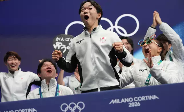 Yuma Kagiyama of Japan reacts to his scores after competing during the figure skating men's team event at the 2026 Winter Olympics, in Milan, Italy, Saturday, Feb. 7, 2026. (AP Photo/Francisco Seco)