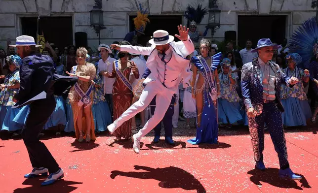 Performers attend a ceremony officially kicking off Carnival in Rio de Janeiro, Friday, Feb. 13, 2026. (AP Photo/Silvia Izquierdo)