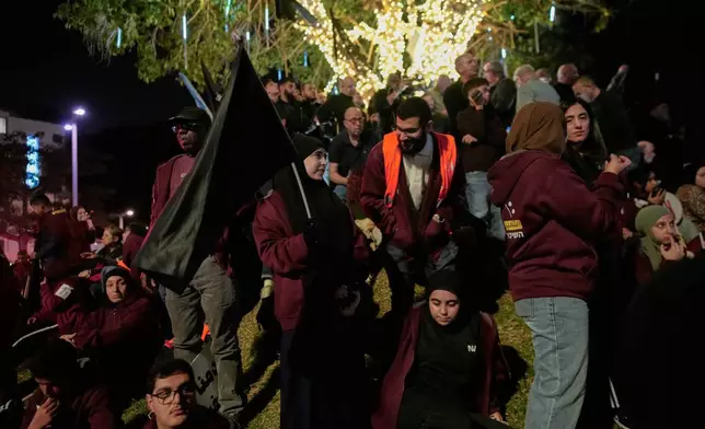 Palestinian citizens of Israel participate in a rally calling for greater security amid rising crime in their communities, in Tel Aviv, Israel, Saturday, Jan. 31, 2026. (AP Photo/Ohad Zwigenberg)