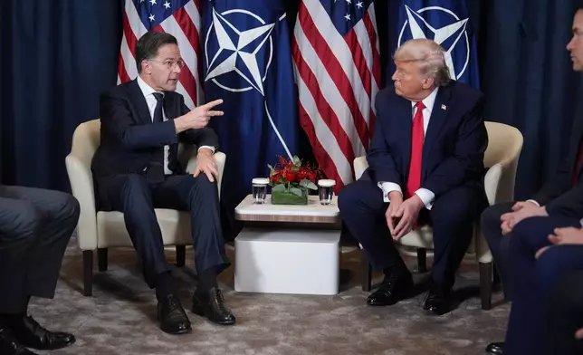 President Donald Trump, right, meets with NATO Secretary General Mark Rutte during a meeting on the sidelines of the Annual Meeting of the World Economic Forum in Davos, Switzerland, Wednesday, Jan. 21, 2026. (AP Photo/Evan Vucci)