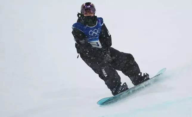 South Korea's Choi Ga-on reacts to her run during the women's snowboarding halfpipe finals at the 2026 Winter Olympics, in Livigno, Italy, Thursday, Feb. 12, 2026. (AP Photo/Lindsey Wasson)