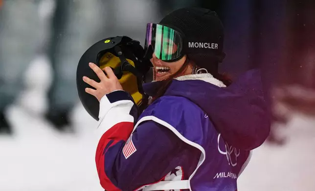 United States' Chloe Kim waits for her score during the women's snowboarding halfpipe finals at the 2026 Winter Olympics, in Livigno, Italy, Thursday, Feb. 12, 2026. (AP Photo/Abbie Parr)