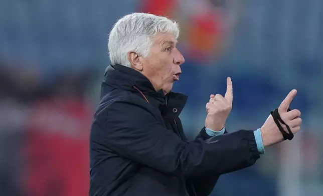 Roma's head coach Gian Piero Gasperini gestures during the Serie A soccer match between Roma and Cremonese in Rome, Italy, Sunday Feb. 22, 2026. (Alfredo Falcone/LaPresse via AP)