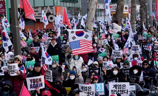 Supporters of former South Korean President Yoon Suk Yeol stage a rally outside of Seoul Central District Court in Seoul, South Korea, Thursday, Feb. 19, 2026. (AP Photo/Ahn Young-joon)