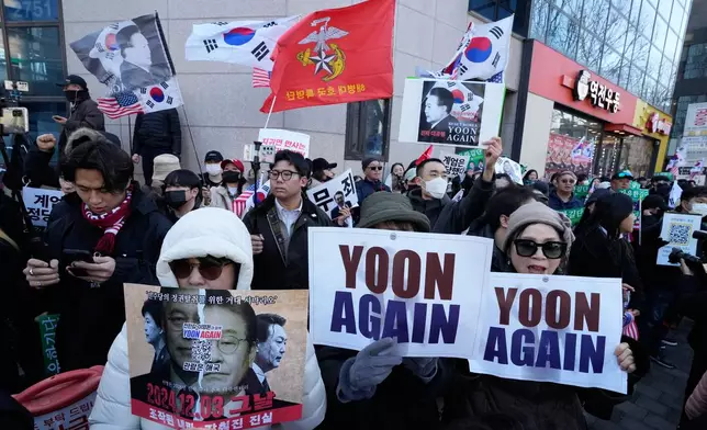 Supporters of former South Korean President Yoon Suk Yeol stage a rally outside of Seoul Central District Court in Seoul, South Korea, Thursday, Feb. 19, 2026. (AP Photo/Ahn Young-joon)