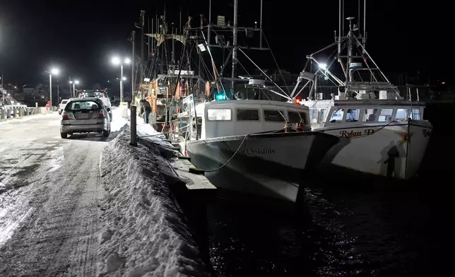 Fishing boats are tied up in Gloucester, Mass., the home port of a vessel that that went missing at sea with seven people aboard, Friday, Jan. 30, 2026. (AP Photo/Robert F. Bukaty)