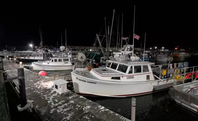 Fishing boats are tied up in Gloucester, Mass., the home port of a vessel that that went missing at sea with seven people aboard, Friday, Jan. 30, 2026. (AP Photo/Robert F. Bukaty)