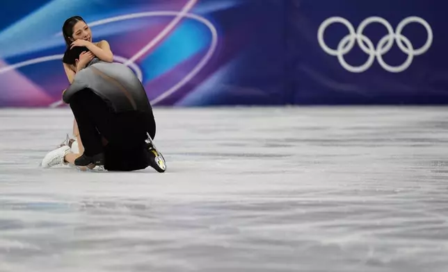 Riku Miura and Ryuichi Kihara of Japan compete during the pairs figure skating long program at the 2026 Winter Olympics, in Milan, Italy, Monday, Feb. 16, 2026. (AP Photo/Francisco Seco)