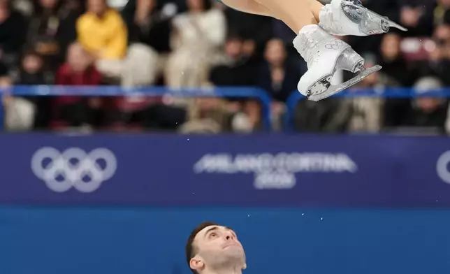 Anastasiia Metelkina and Luka Berulava of Georgia compete during the pairs figure skating long program at the 2026 Winter Olympics, in Milan, Italy, Monday, Feb. 16, 2026. (AP Photo/Francisco Seco)