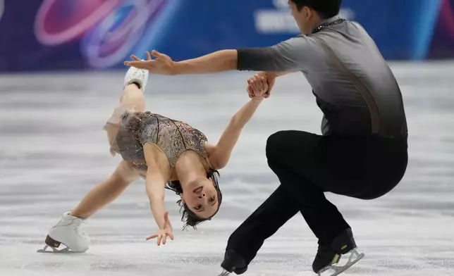 Riku Miura and Ryuichi Kihara of Japan compete during the pairs figure skating long program at the 2026 Winter Olympics, in Milan, Italy, Monday, Feb. 16, 2026. (AP Photo/Stephanie Scarbrough)