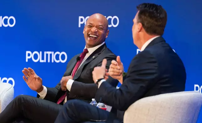 Maryland Gov. Wes Moore laughs with Oklahoma Gov. Kevin Stitt at an event at the National Governors Association Winter Meeting, Thursday, Feb. 19, 2026, in Washington. (AP Photo/Allison Robbert)