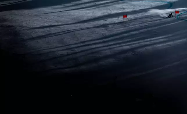 Canada's James Crawford speeds down the course during a men's super-G race at the 2026 Winter Olympics, Wednesday, Feb. 11, 2026, in Bormio, Italy. (AP Photo/Julia Demaree Nikhinson)