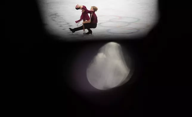 Diana Davis and Gleb Smolkin of Georgia compete during the ice dancing free skate in figure skating at the 2026 Winter Olympics, in Milan, Italy, Wednesday, Feb. 11, 2026. (AP Photo/Francisco Seco)