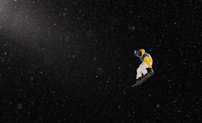 Australia's Valentino Guseli practices before the men's snowboarding halfpipe qualifications at the 2026 Winter Olympics, in Livigno, Italy, Wednesday, Feb. 11, 2026. (AP Photo/Gregory Bull)