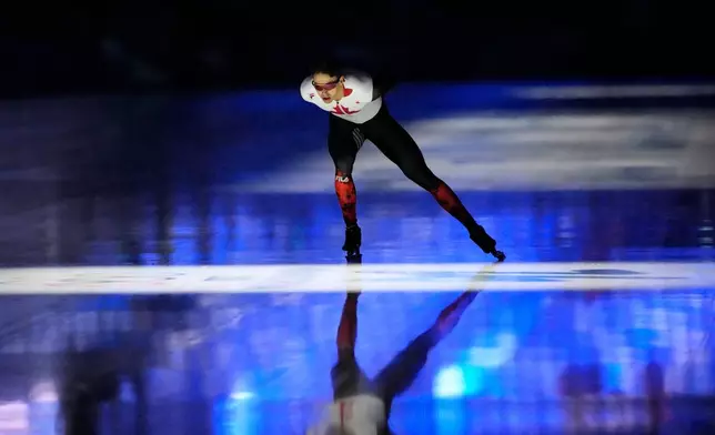 Anders Johnson of Canada warms up prior to competing in the men's 1,000 meters speedskating race at the 2026 Winter Olympics, in Milan, Italy, Wednesday, Feb. 11, 2026. (AP Photo/Ben Curtis)