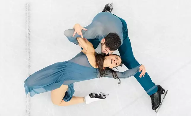 Laurence Fournier Beaudry and Guillaume Cizeron of France compete during the ice dancing free skate in figure skating at the 2026 Winter Olympics, in Milan, Italy, Wednesday, Feb. 11, 2026. (AP Photo/Bernat Armangue)