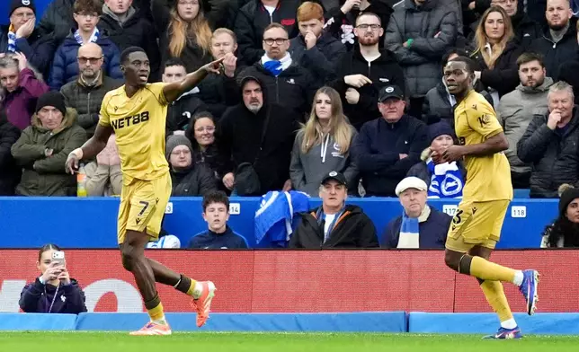 Crystal Palace's Ismaila Sarr, left, celebrates scoring their side's first goal of the game during their English Premier League soccer match against Brighton &amp; Hove Albion in Brighton, England, Sunday, Feb. 8, 2026. (Adam Davy/PA via AP)