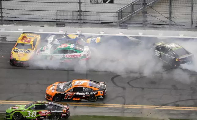 Cars crash on the checkered flag during the NASCAR Daytona 500 auto race at Daytona International Speedway, Sunday, Feb. 15, 2026, in Daytona Beach, Fla. (AP Photo/John Raoux)