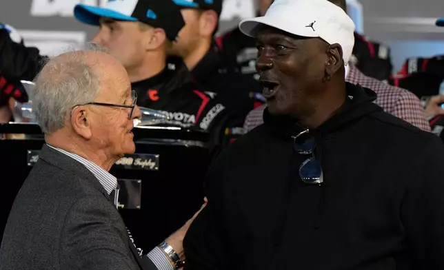 23XI Racing owner Michael Jordan speaks with CEO and Chairman of NASCAR, Jim Frantz after Tyler Reddick won the NASCAR Daytona 500 auto race at Daytona International Speedway, Sunday, Feb. 15, 2026, in Daytona Beach, Fla. (AP Photo/Nigel Cook)