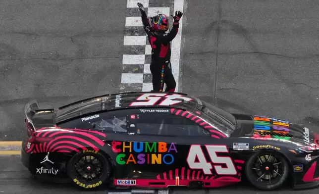 Tyler Reddick, (45) celebrates winning the NASCAR Daytona 500 auto race at Daytona International Speedway, Sunday, Feb. 15, 2026, in Daytona Beach, Fla. (AP Photo/John Raoux)