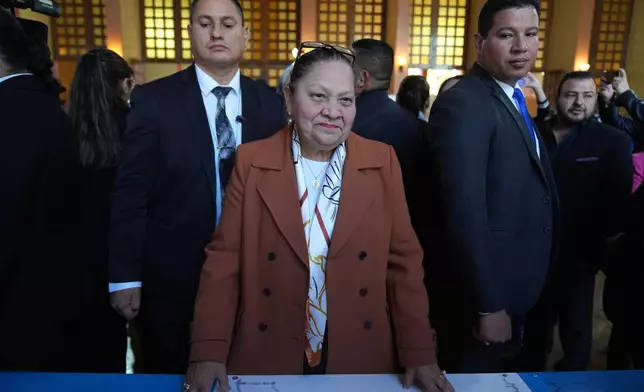Guatemalan General Attorney Consuelo Porras prepares to cast her ballot in the election of magistrates representing the bar association on the Constitutional Court in Guatemala City, Thursday, Feb. 12, 2026. (AP Photo/Moises Castillo)
