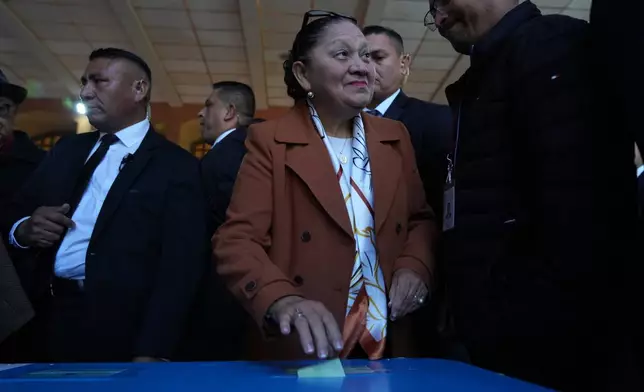 Guatemalan General Attorney Consuelo Porras casts her ballot in the election of magistrates representing the bar association on the Constitutional Court in Guatemala City, Thursday, Feb. 12, 2026. (AP Photo/Moises Castillo)