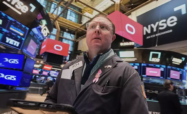 Trader Ryan Falvey works on the floor of the New York Stock Exchange, Tuesday, Feb. 3, 2026. (AP Photo/Richard Drew)