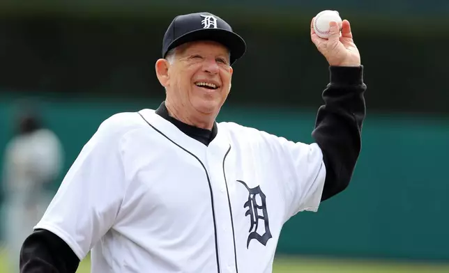 FILE - Former Detroit Tigers pitcher Mickey Lolich throws out the ceremonial first pitch before a baseball game between the Tigers and the Pittsburgh Pirates, March 30, 2018, in Detroit. (AP Photo/Carlos Osorio, File)