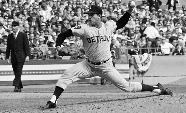 FILE - In this Oct. 3, 1968, file photo, Mickey Lolich of the Detroit Tigers is shown pitching during the second game of the World Series against the St. Louis Cardinals at Busch Stadium in St. Louis. (AP Photo/File)