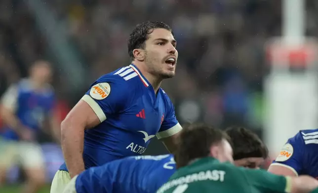 France's Antoine Dupont challenges for the ball during the Six Nations rugby match between France and Ireland in Paris, Thursday, Feb. 5, 2026. (AP Photo/Thibault Camus)