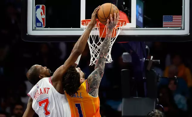 Houston Rockets forward Kevin Durant (7) blocks a shot attempt by Charlotte Hornets guard LaMelo Ball during the first half of an NBA basketball game in Charlotte, N.C., Thursday, Feb. 19, 2026. (AP Photo/Nell Redmond)