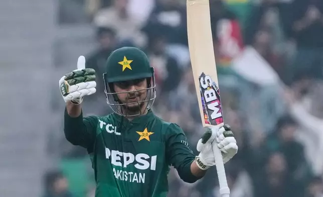 Pakistan's Saim Ayub celebrates after his fifty runs during the third T20 cricket match between Pakistan and Australia, in Lahore, Pakistan, Sunday, Feb. 1, 2026. (AP Photo/K.M. Chaudary)