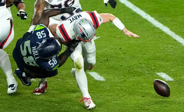 Seattle Seahawks linebacker Derick Hall (58) sacks New England Patriots quarterback Drake Maye (10) causing a fumble during the second half of the NFL Super Bowl 60 football game, Sunday, Feb. 8, 2026, in Santa Clara, Calif. (AP Photo/Charlie Riedel)