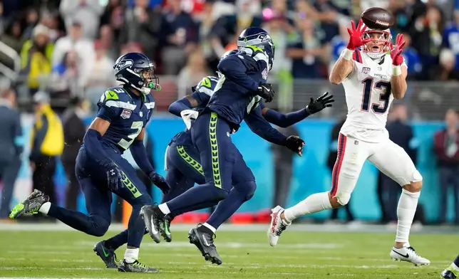 New England Patriots wide receiver Mack Hollins (13) makes a catch during the second half of the NFL Super Bowl 60 football game against the Seattle Seahawks, Sunday, Feb. 8, 2026, in Santa Clara, Calif. (AP Photo/Julio Cortez)