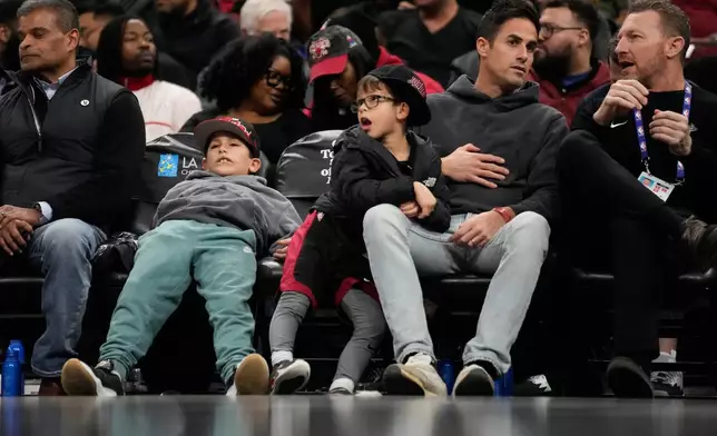 Young Chicago Bulls fans watch an NBA basketball game against the Miami Heat, Thursday, Jan. 29, 2026, in Chicago. (AP Photo/Erin Hooley)